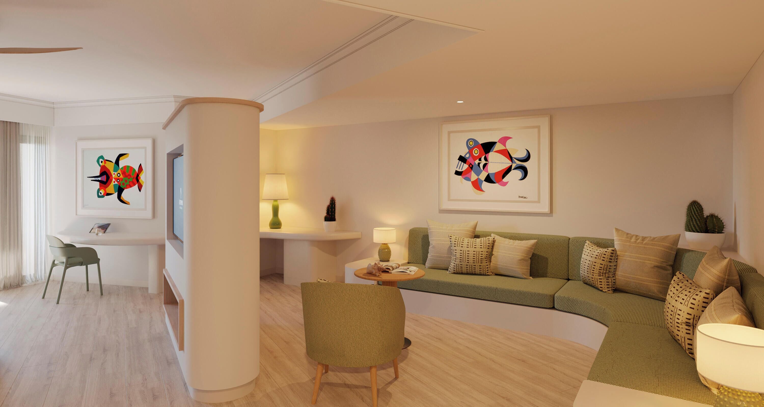 A modern living room with a sofa, a dining area, and artwork on the walls.
