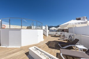 Seasonal outdoor pool, open 10:00 AM to 8:00 PM, pool umbrellas