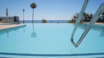 Indoor pool, outdoor pool, pool umbrellas, sun loungers