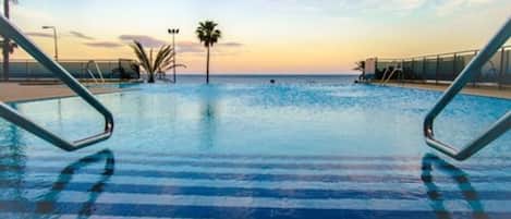 Indoor pool, outdoor pool, pool umbrellas, sun loungers