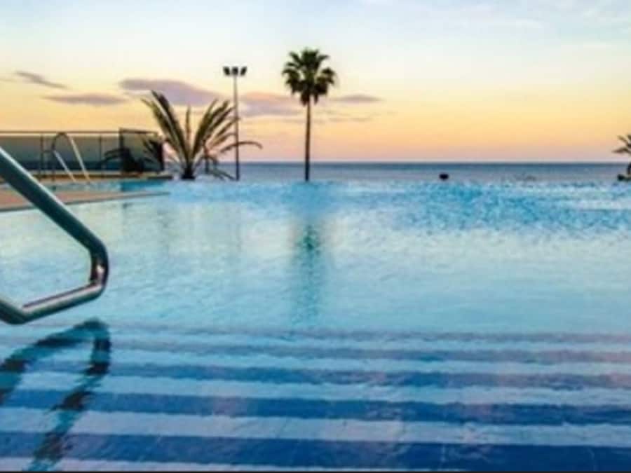 Indoor pool, outdoor pool, pool umbrellas, pool loungers