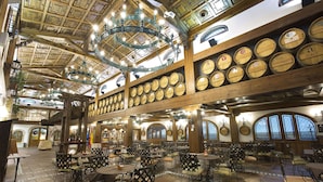 A spacious indoor dining area with high wooden ceilings and multiple tables and chairs. - Hotel Tudanca Aranda II (Fuentespina)
