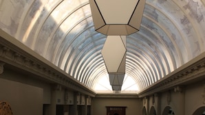 A grand hallway with a vaulted ceiling, marble flooring, and classical columns. - Hotel Tudanca Aranda II (Fuentespina)