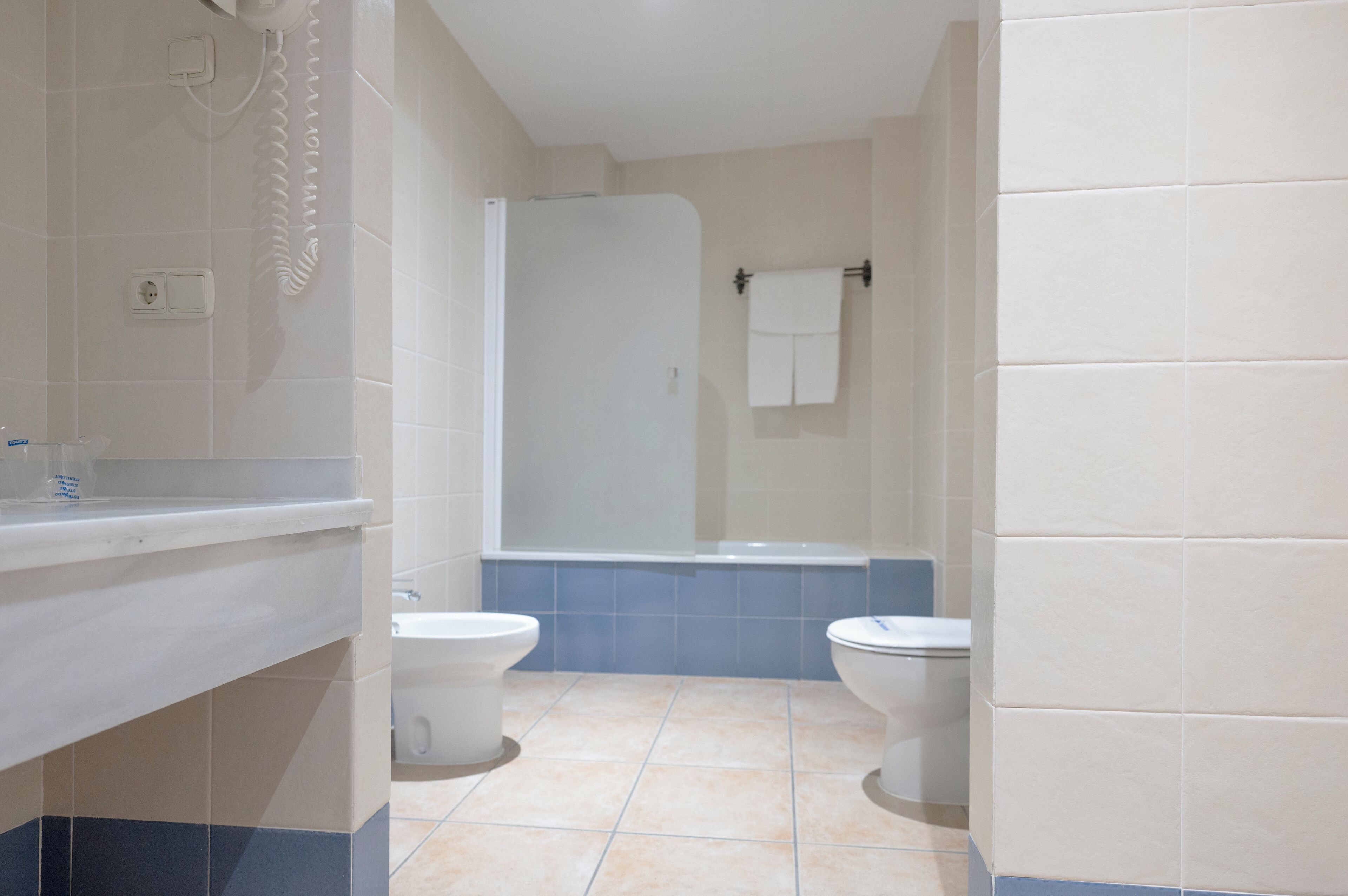 superior room | bathroom | bathtub, hair dryer, bidet, towels