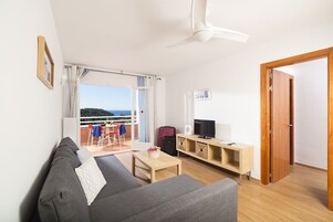 Apartment, 1 Bedroom, Sea View (3 adults) | Living room | Flat-screen TV