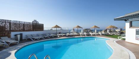 Outdoor pool, a rooftop pool, sun loungers