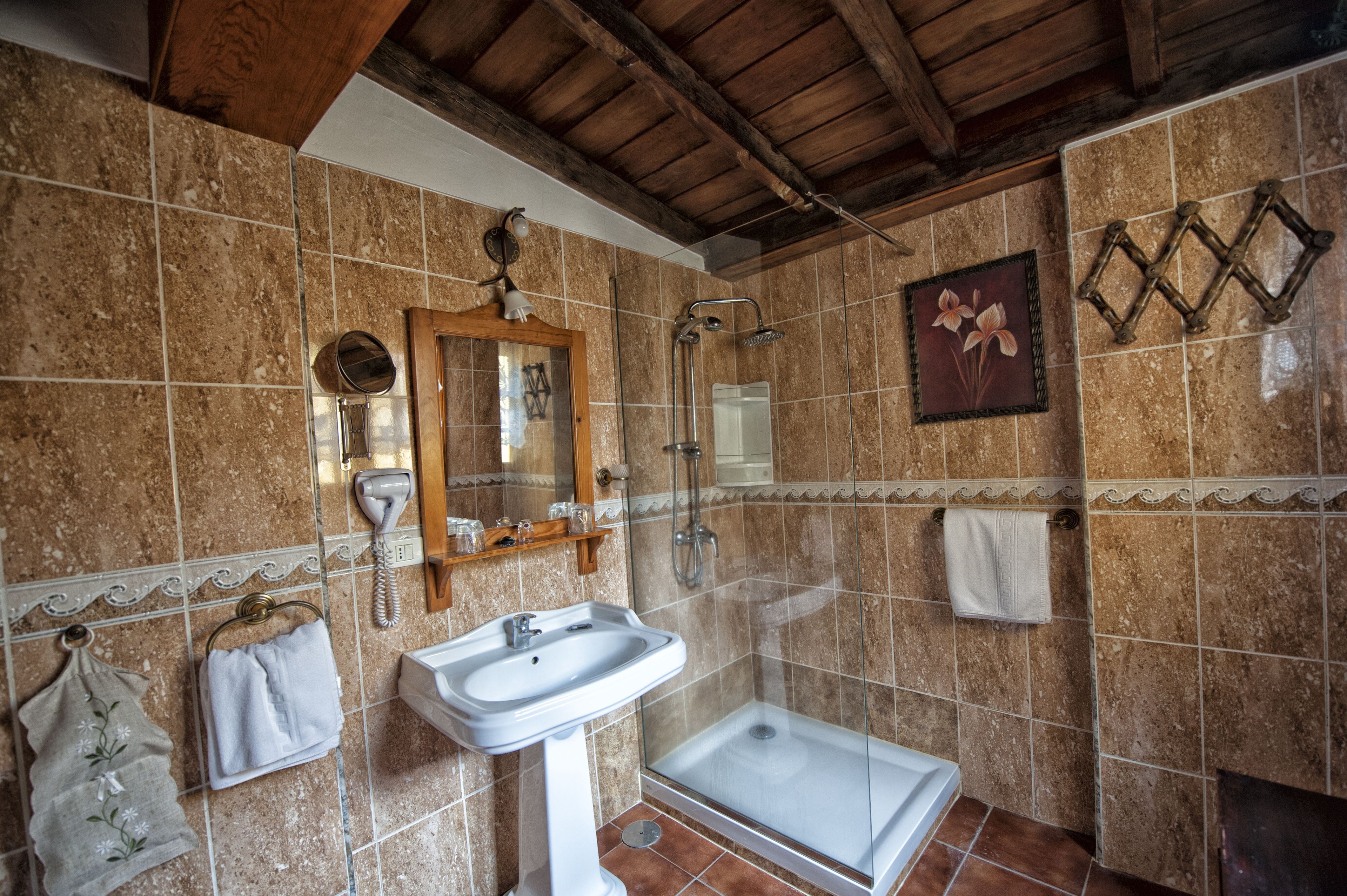 designer toiletries, hair dryer, towels