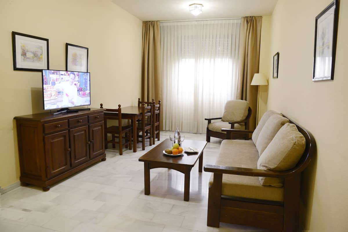 double room (with living) | living area | flat-screen tv