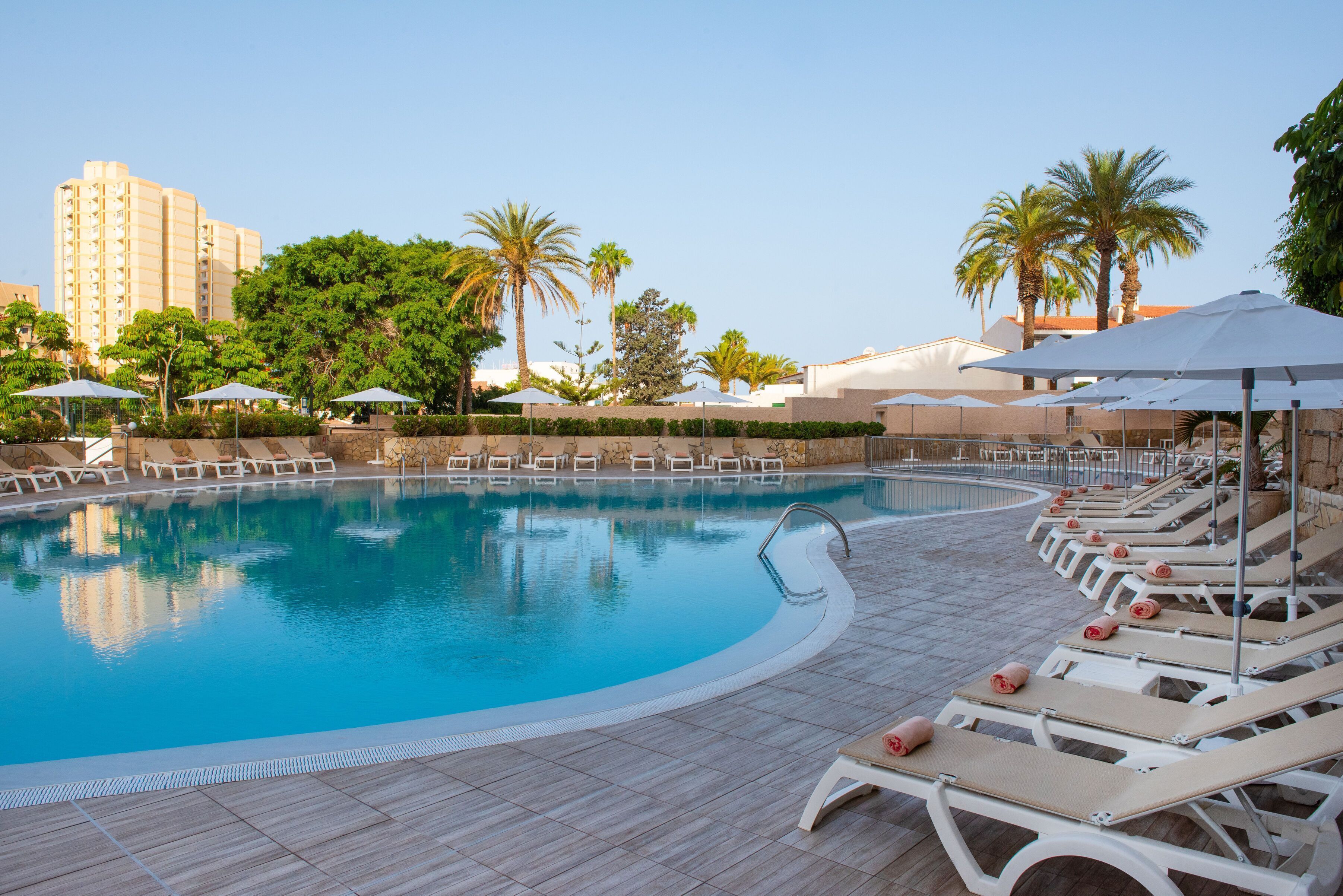 outdoor pool, pool umbrellas, pool loungers