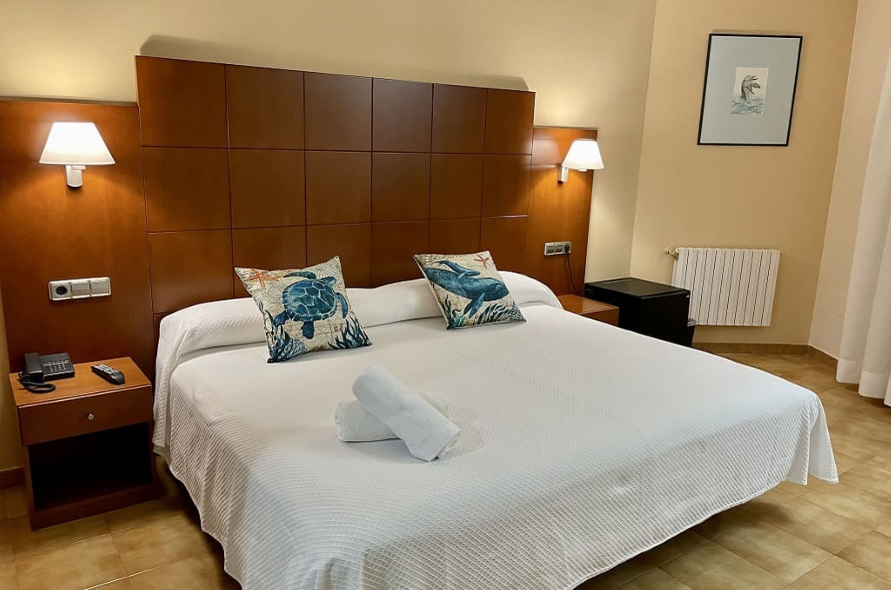 quad room for 2 adults and 2 children | select comfort beds, individually decorated, desk, iron/ironing board