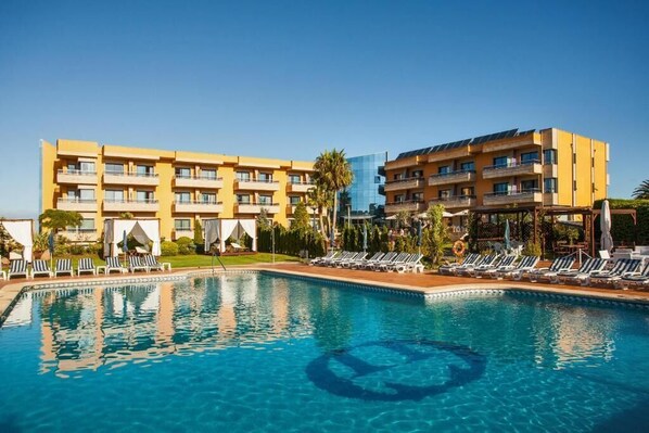 Indoor pool, seasonal outdoor pool, pool umbrellas, pool loungers