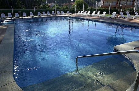 Indoor pool, seasonal outdoor pool, pool umbrellas, sun loungers