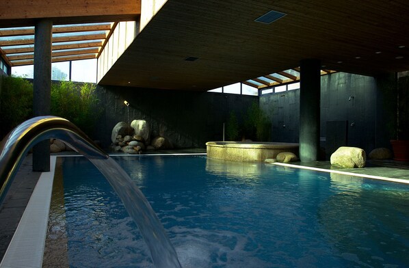Indoor pool, seasonal outdoor pool, pool umbrellas, pool loungers