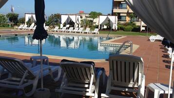 Indoor pool, seasonal outdoor pool, pool umbrellas, sun loungers