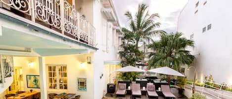 Outdoor pool, open 7:00 AM to 10:00 PM, pool umbrellas, pool loungers
