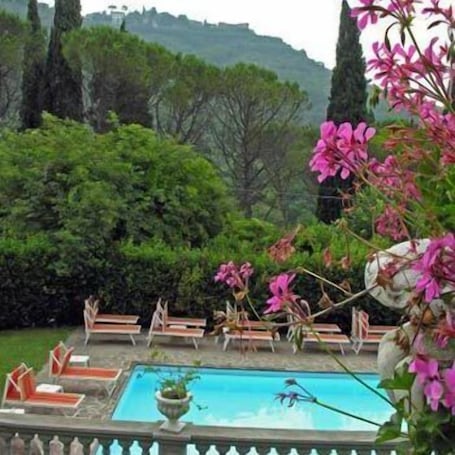 Seasonal outdoor pool, open 9:00 AM to 7:00 PM, sun loungers