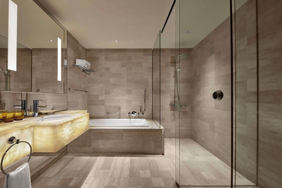 suite, 1 king bed, city view | bathroom | separate bathtub and shower, deep-soaking bathtub, rainfall showerhead