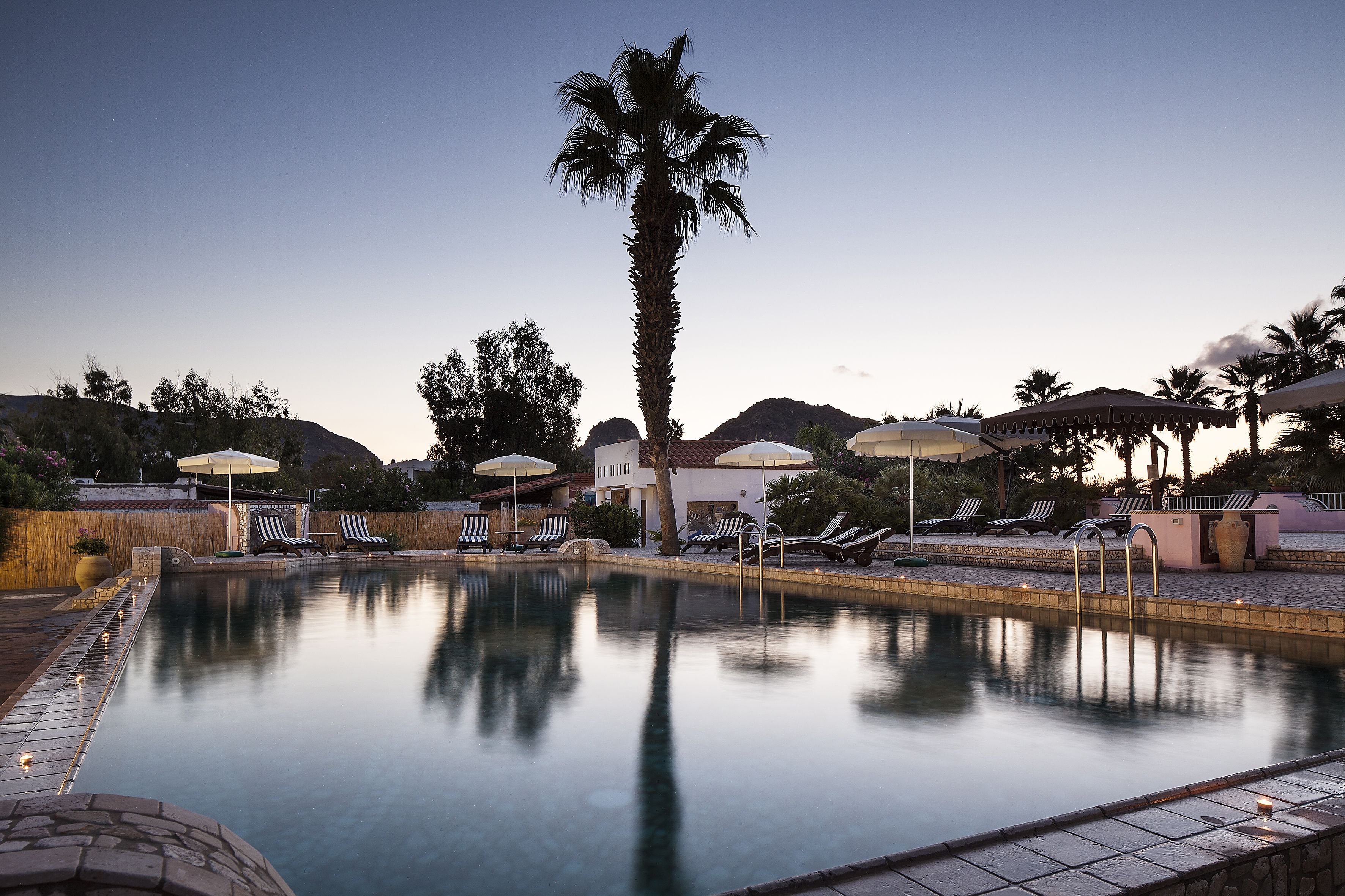 seasonal outdoor pool, open 8:30 am to 8:00 pm, pool umbrellas