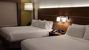 A hotel room with two beds, a nightstand with a phone and a lamp, and a wall-mounted light fixture. - Holiday Inn Express & Suites Claypool Hill (Richlands Area) by IHG (Pounding Mill)