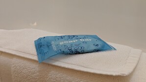 A white towel with a blue soap bar on it. - Holiday Inn Express & Suites Claypool Hill (Richlands Area) by IHG (Pounding Mill)