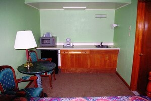 Room, 2 Queen Beds | Private kitchenette | Fridge, microwave, coffee/tea maker