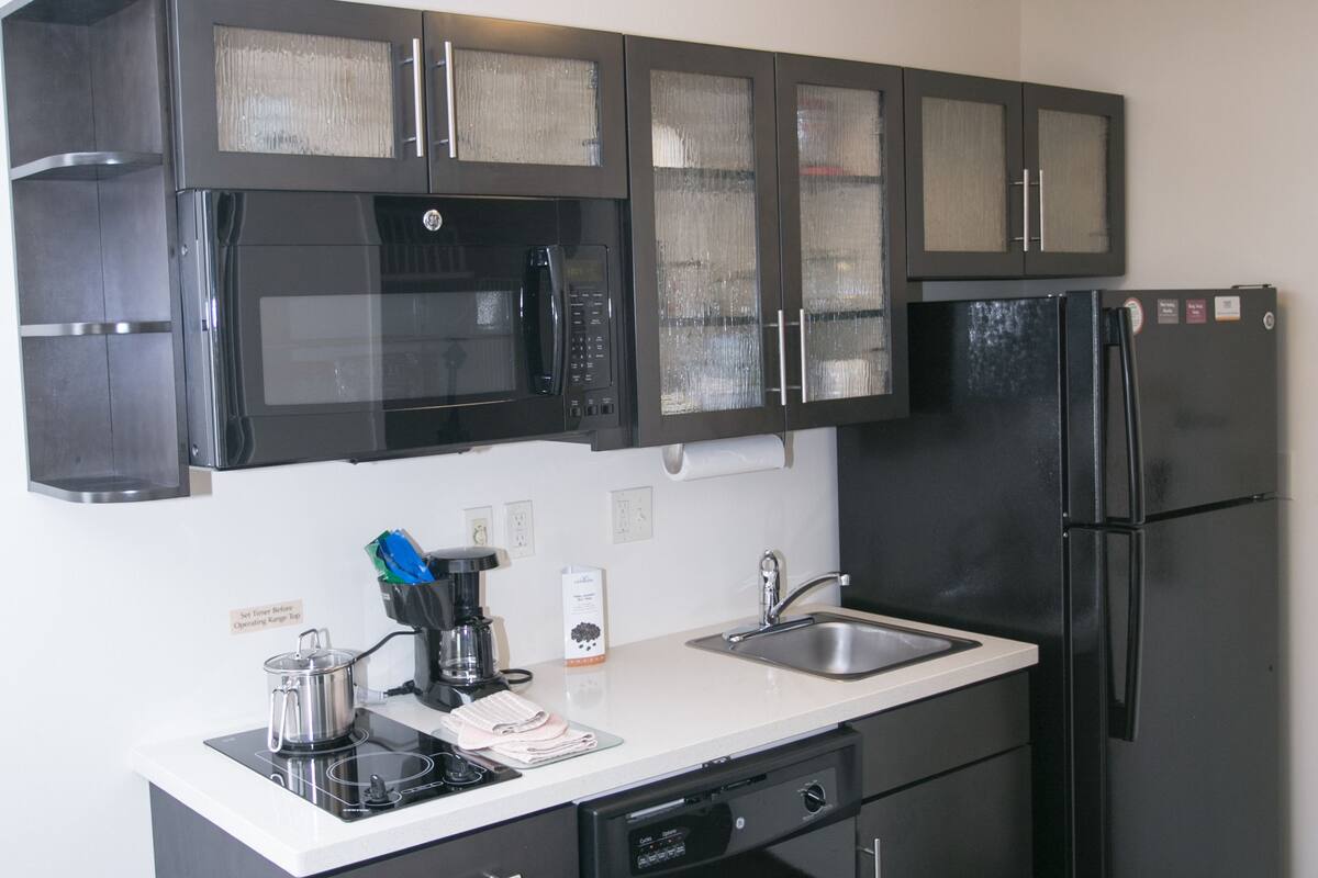 full-sized fridge, microwave, stovetop, dishwasher