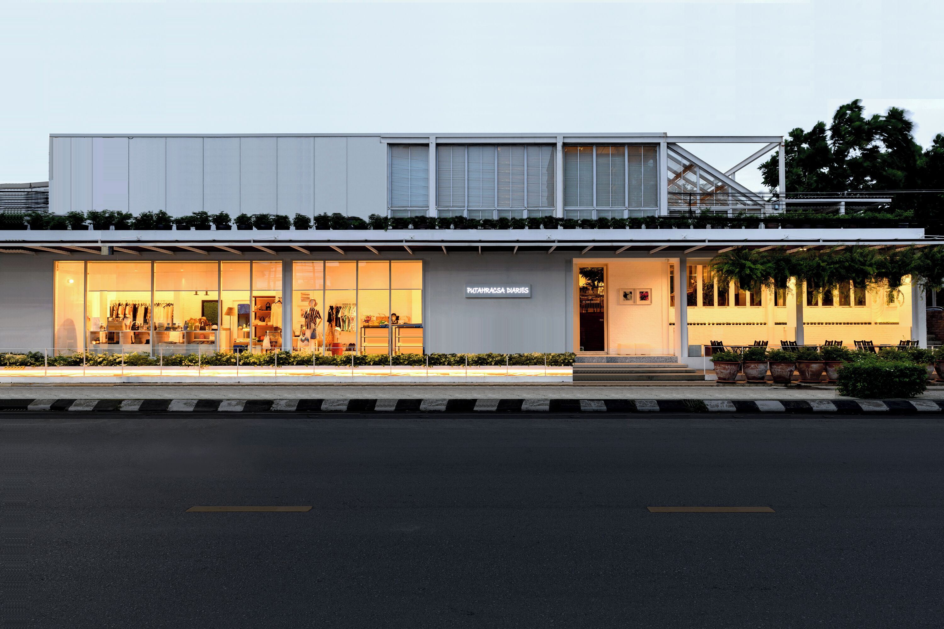 A modern building with a storefront and a covered entrance.