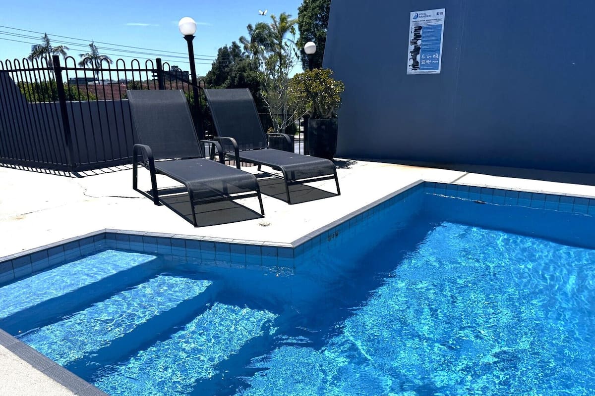 Premium bedding, pillow-top beds, laptop workspace, blackout curtains