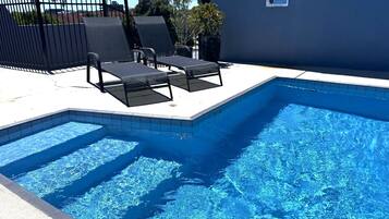 Premium bedding, pillow-top beds, laptop workspace, blackout curtains