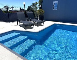 Premium bedding, pillowtop beds, laptop workspace, blackout drapes