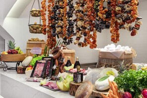 A variety of cheeses, cured meats, and fresh produce displayed on a counter. - Marti Resort Hotel (Marmaris)