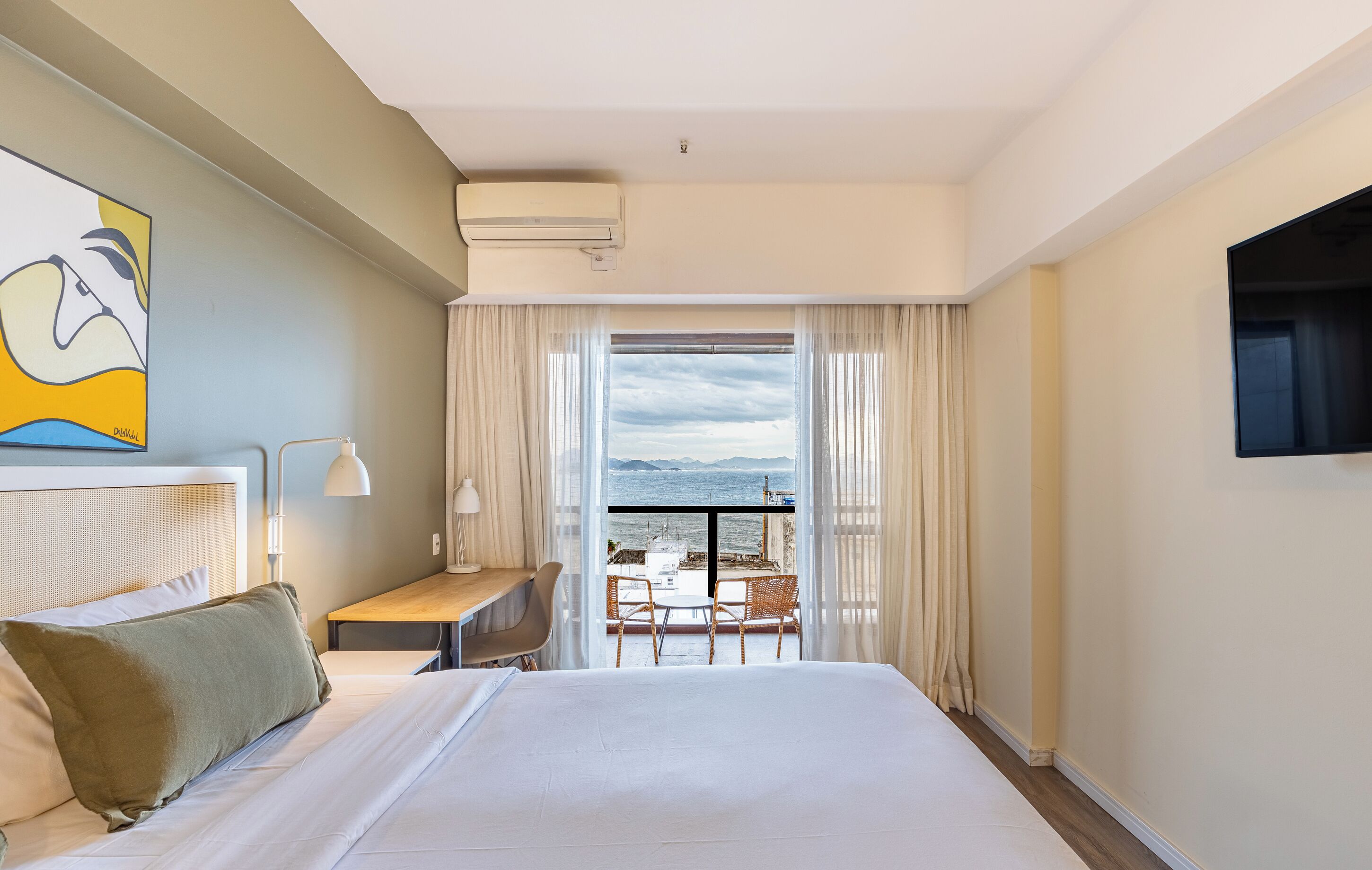 Deluxe Double Room, Partial Sea View | Hypo-allergenic bedding, pillow-top beds, minibar, in-room safe