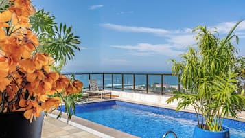 Outdoor pool, open 10 AM to 10 PM, sun loungers