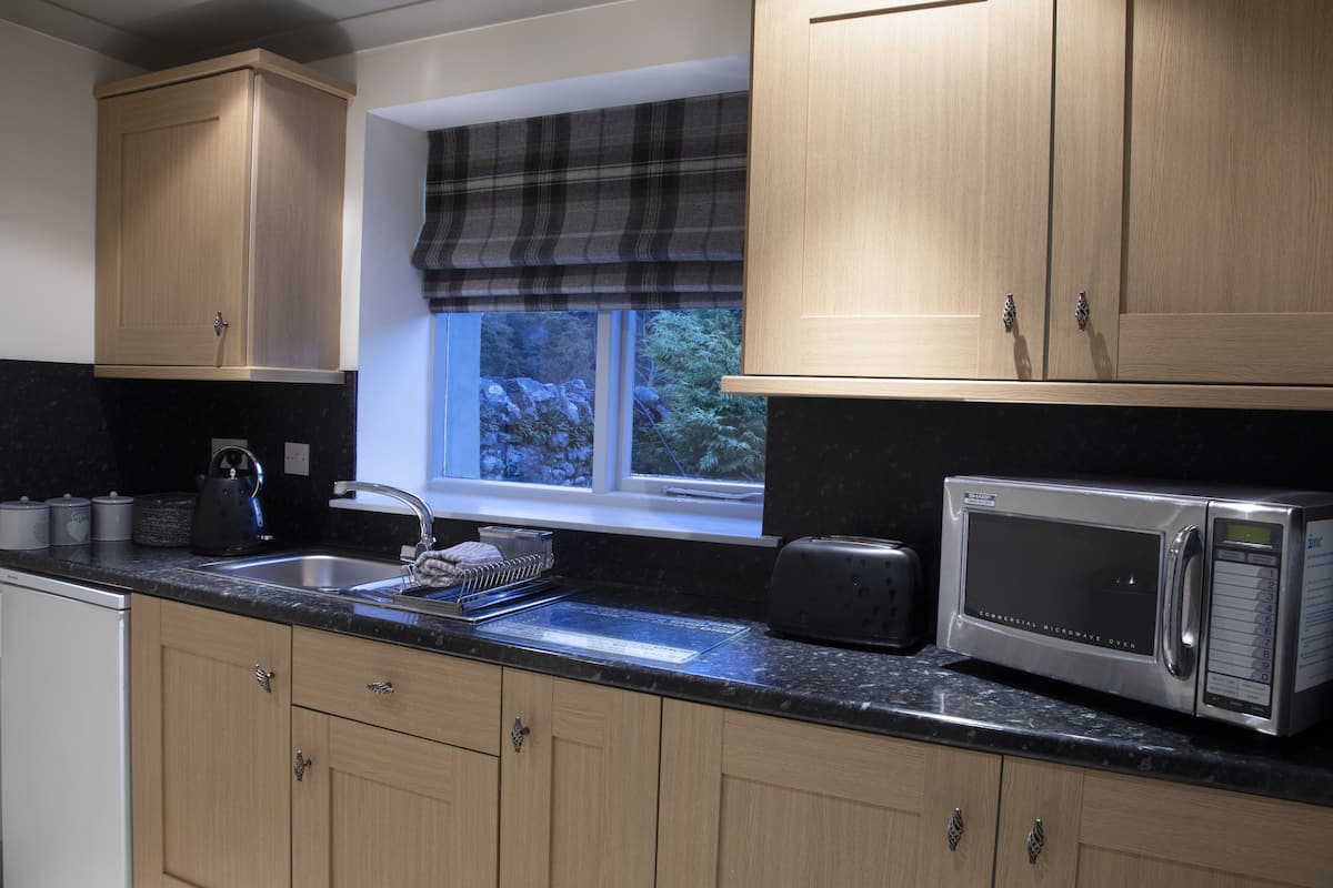 cottage, garden area | premium bedding, in-room safe, individually decorated