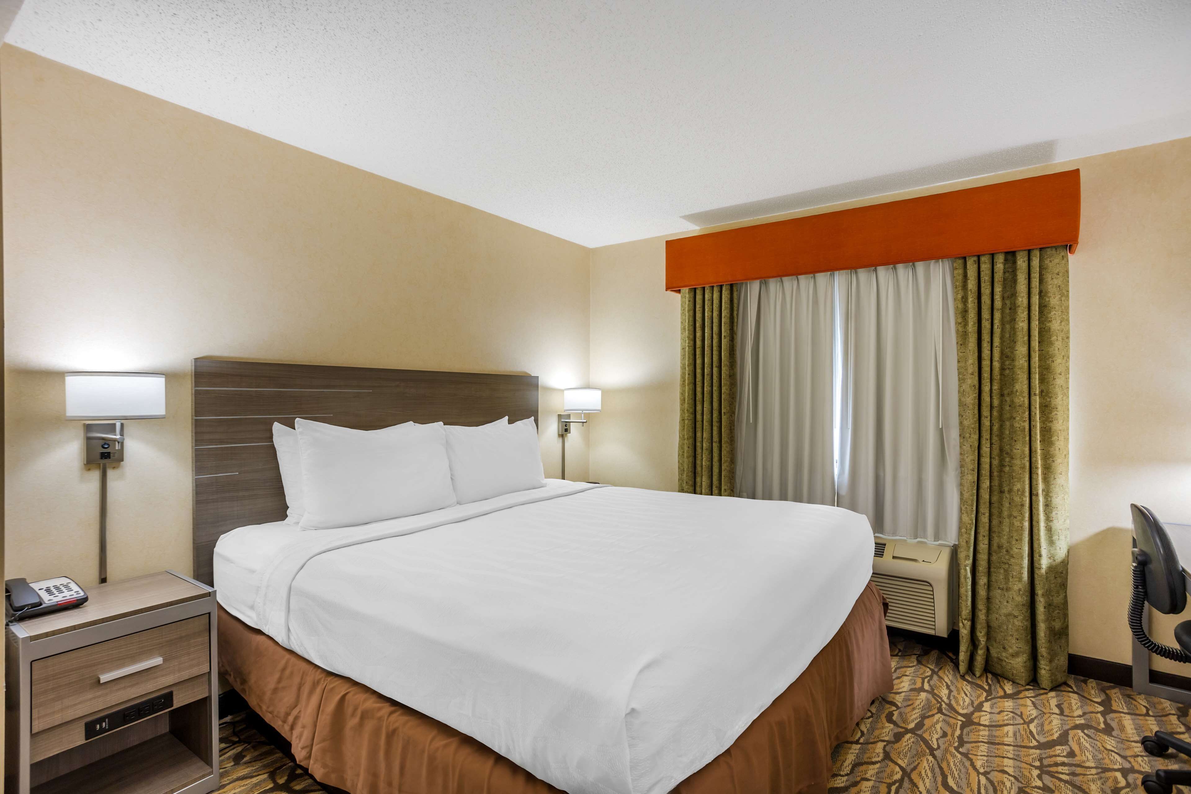 suite, 1 king bed, non smoking, refrigerator & microwave | desk, laptop workspace, iron/ironing board, wifi