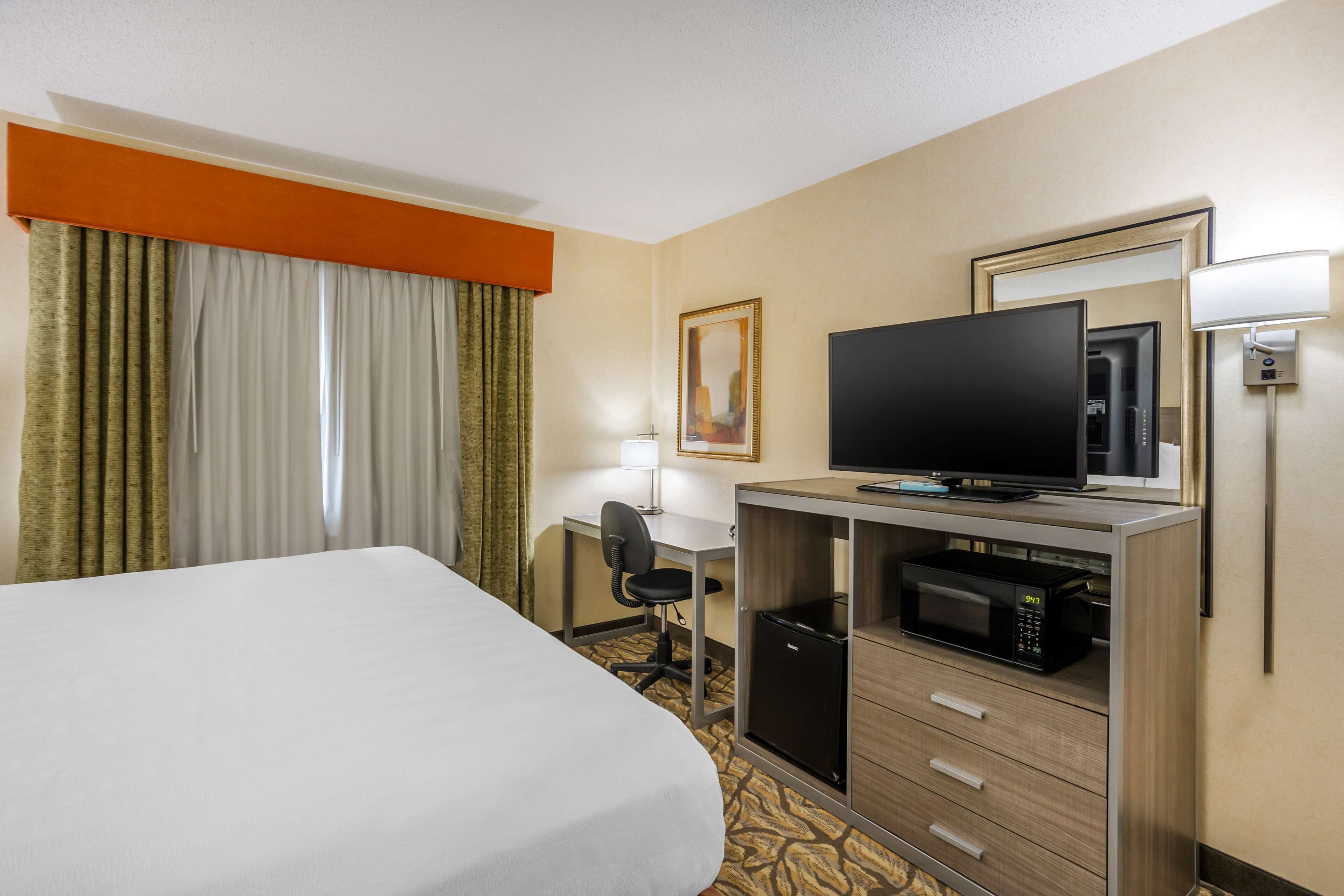 suite, 1 king bed, non smoking, refrigerator & microwave | desk, laptop workspace, iron/ironing board, wifi