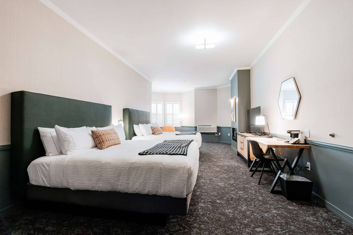 room, 2 queen beds | in-room safe, desk, iron/ironing board, cots/infant beds