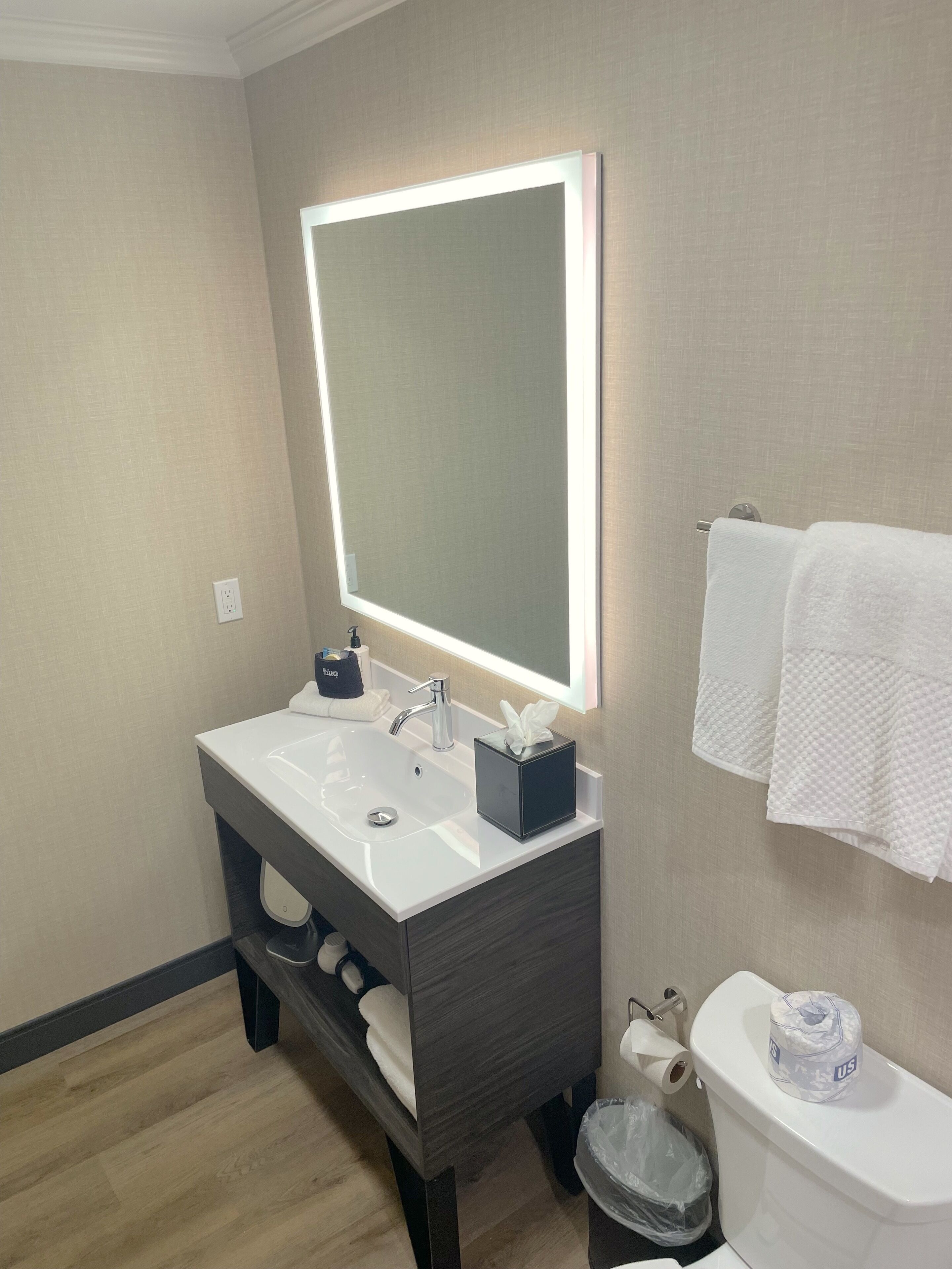 designer toiletries, hair dryer, towels