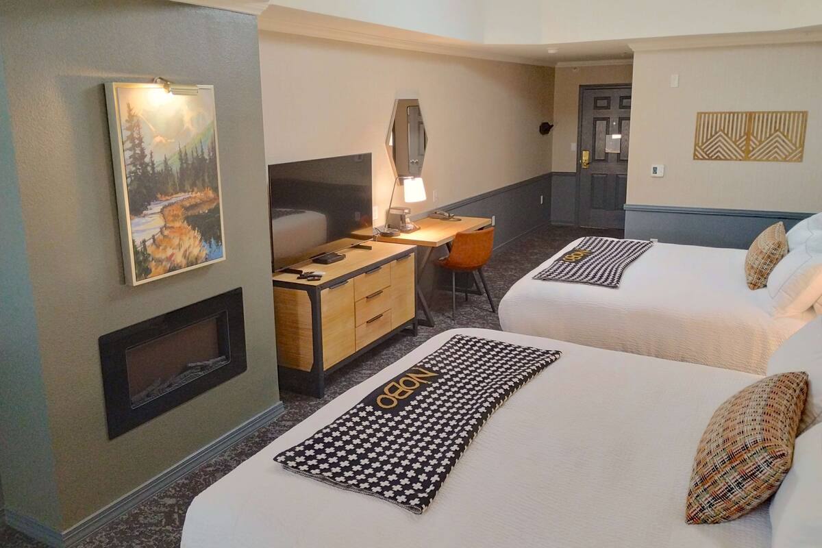 room, 2 queen beds | in-room safe, desk, iron/ironing board, cots/infant beds