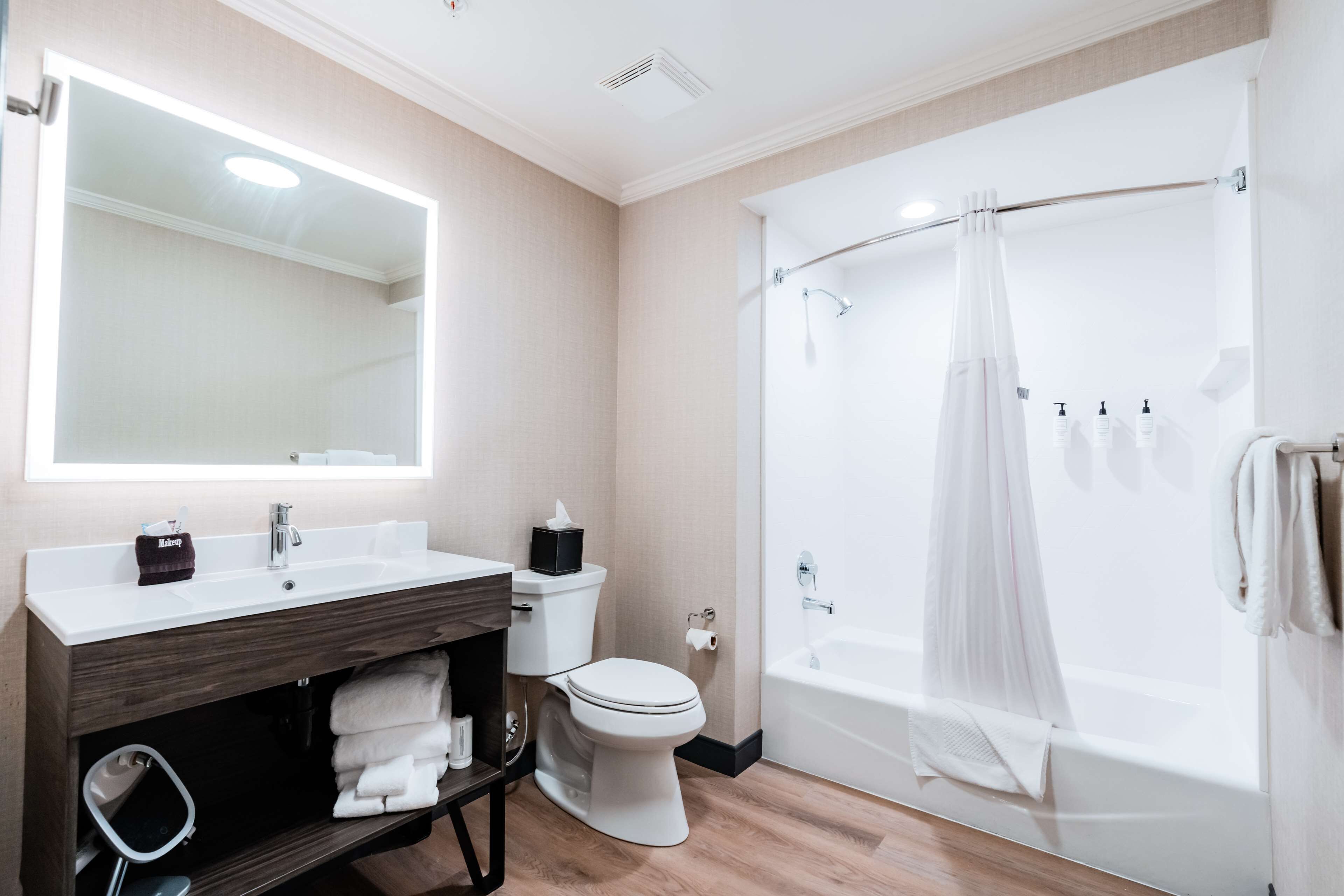 studio suite, 1 king bed | bathroom | designer toiletries, hair dryer, towels
