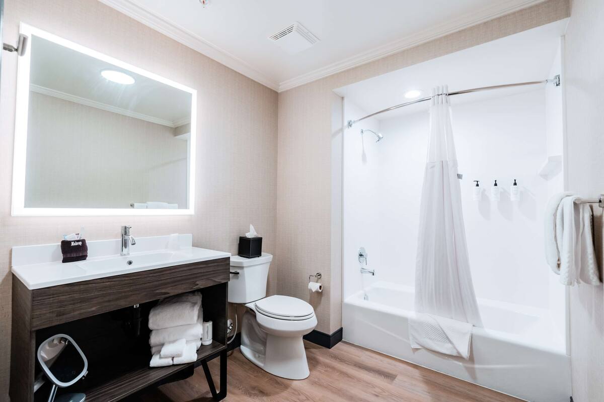 studio suite, 1 king bed | bathroom | designer toiletries, hair dryer, towels