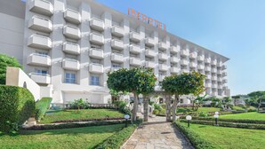 A modern hotel with a white facade and multiple balconies. - Iberotel Luxor by JAZ (Luxor)