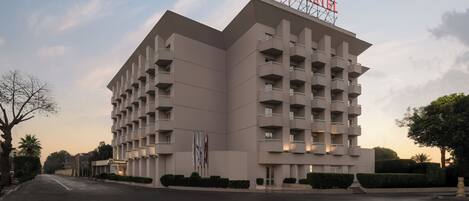 A modern hotel with a prominent 'IBERETEL' sign, multiple balconies, and a clean, symmetrical facade.