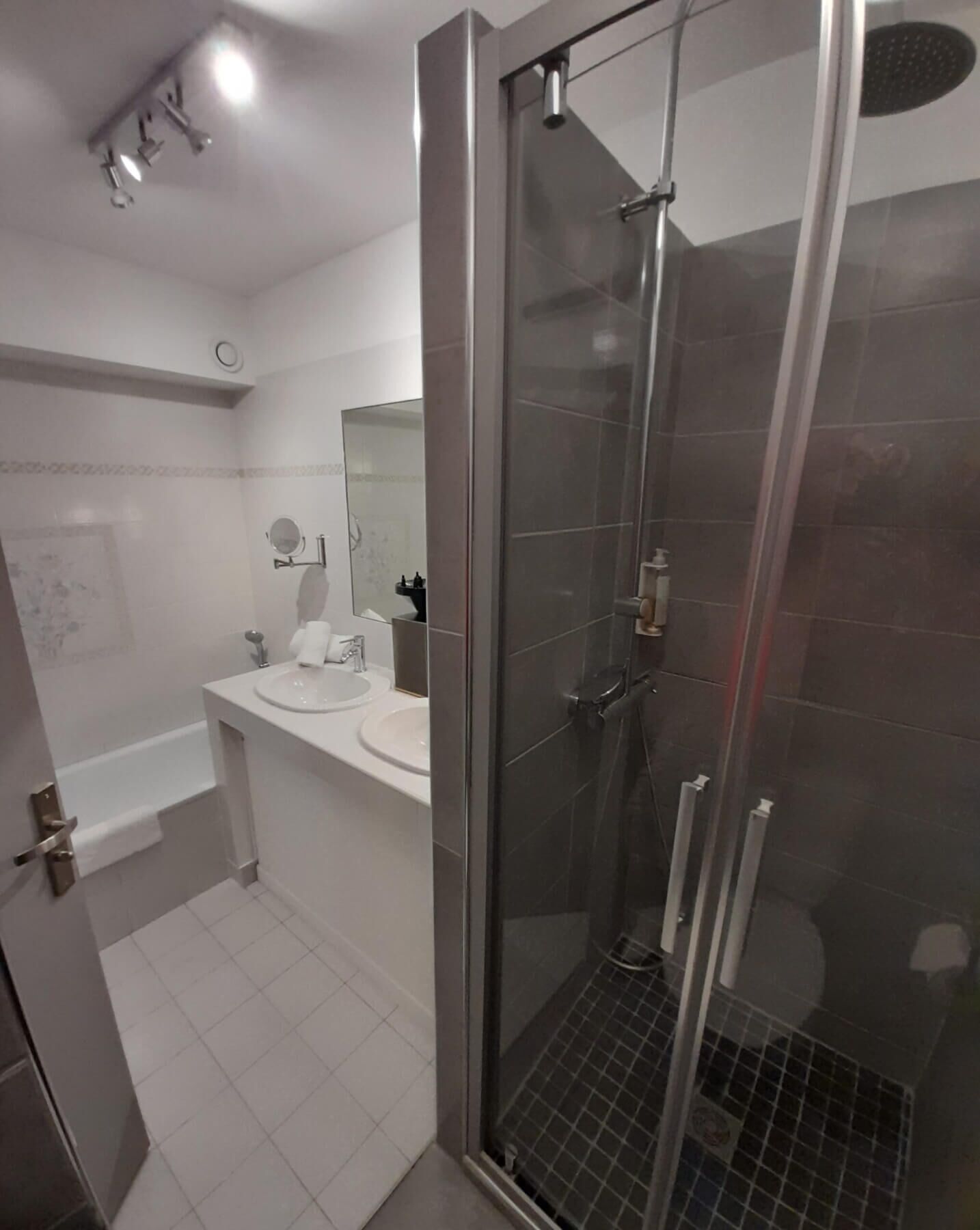separate bathtub and shower, free toiletries, hair dryer, slippers