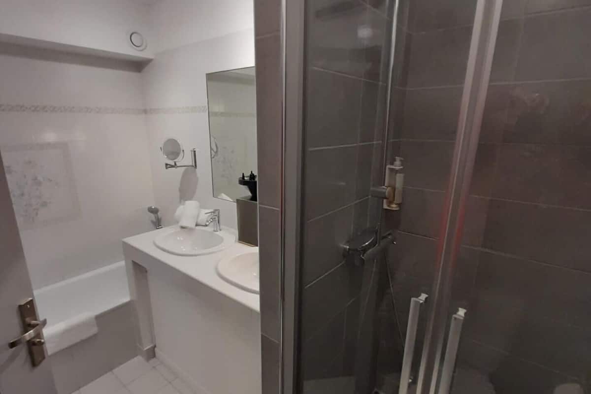separate bathtub and shower, free toiletries, hair dryer, slippers