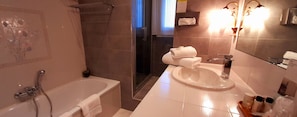 Separate bathtub and shower, free toiletries, hair dryer, slippers