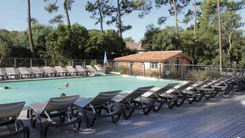 Seasonal outdoor pool, pool loungers