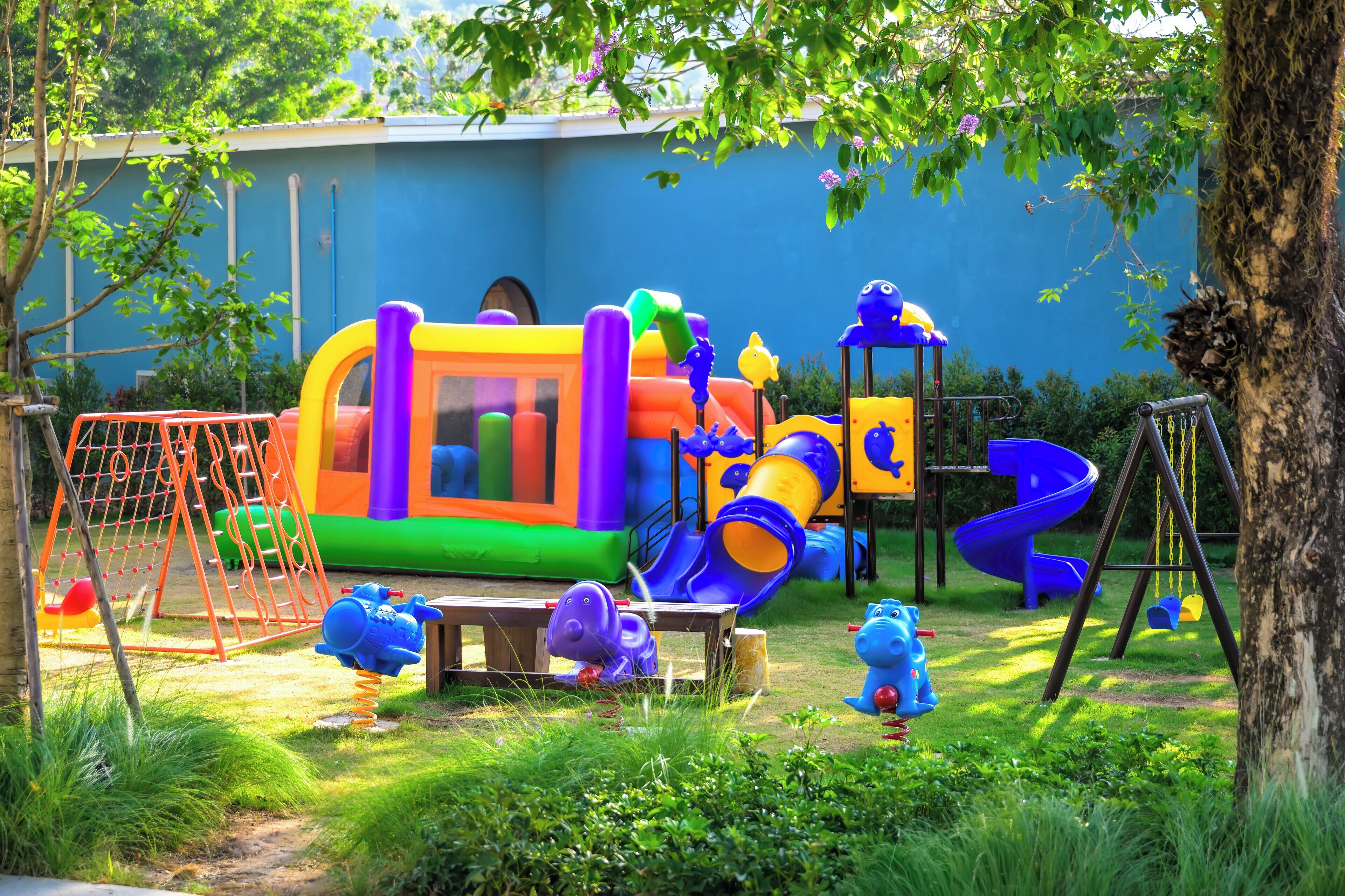 A playground with a slide, swings, and a climbing structure.