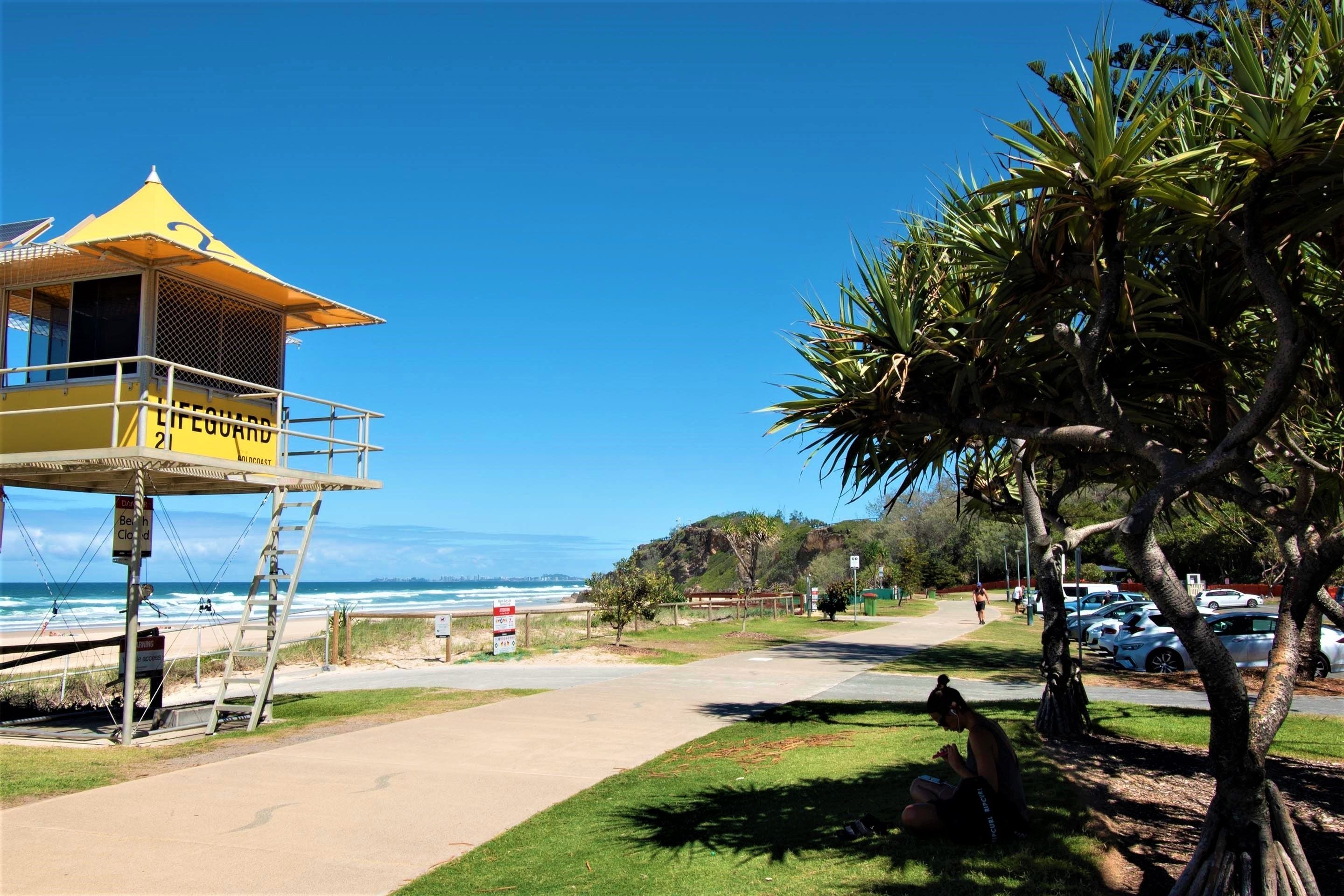 A lifeguard tower with a clear view of the beach and ocean.