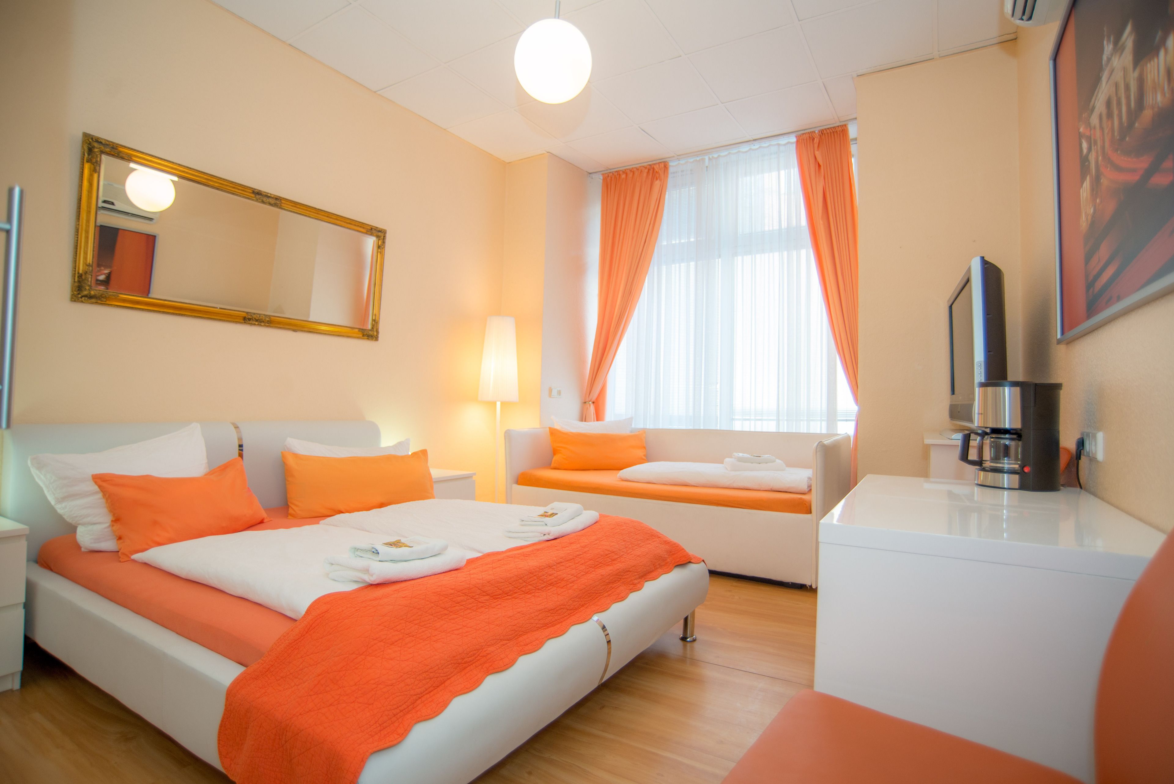 Triple Room | Minibar, in-room safe, individually decorated, individually furnished